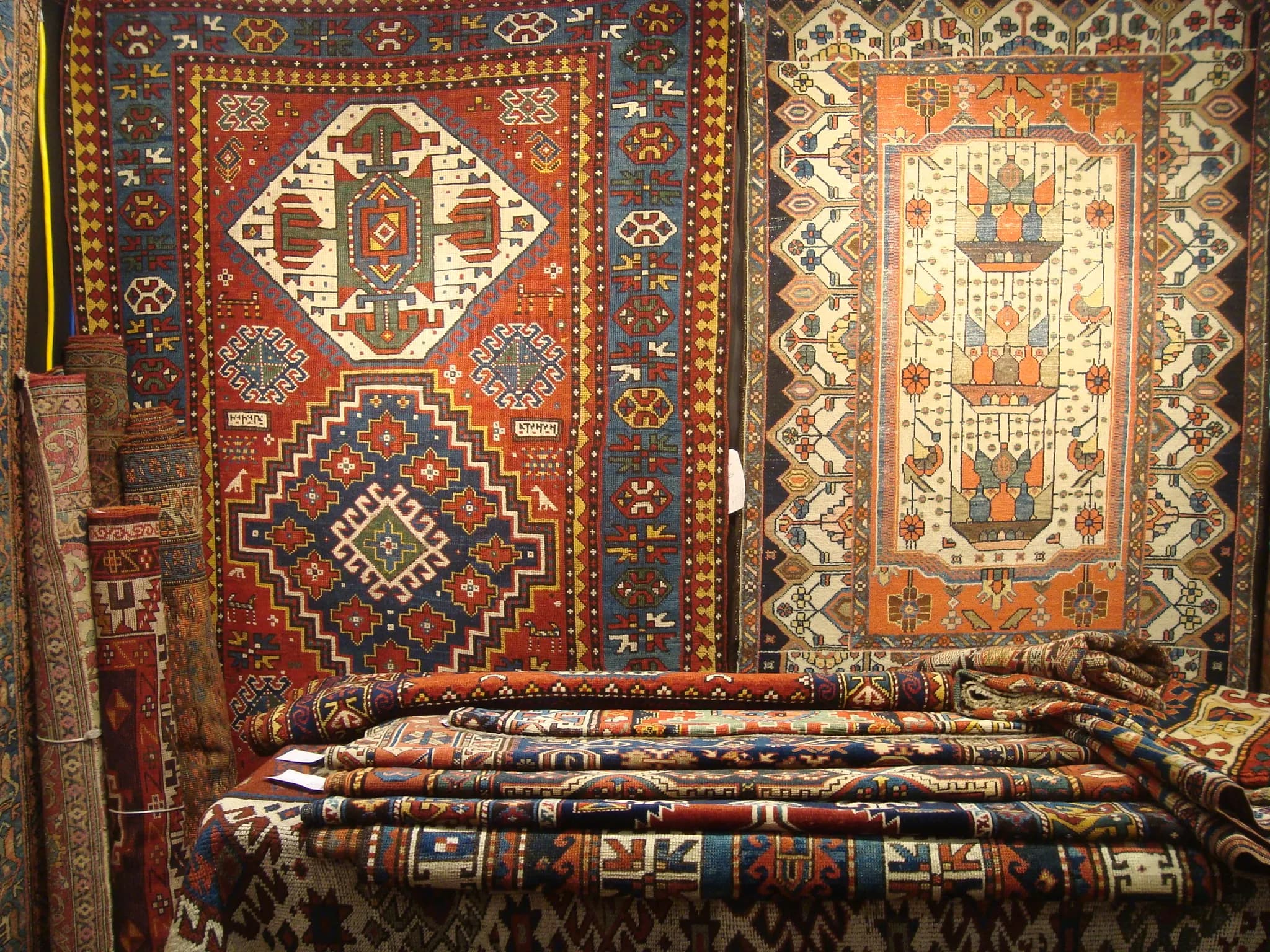 Collection of small antique scatter rugs in various Persian and Caucasian styles