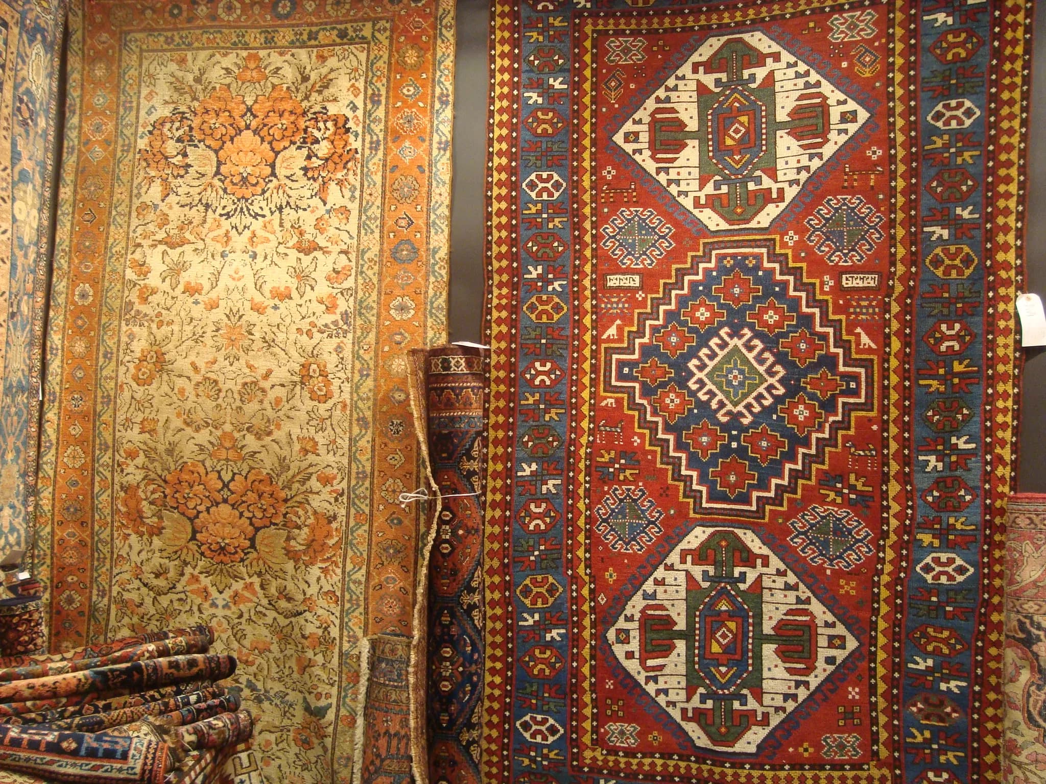Large room-size antique Persian carpet with ornate floral and vine motifs